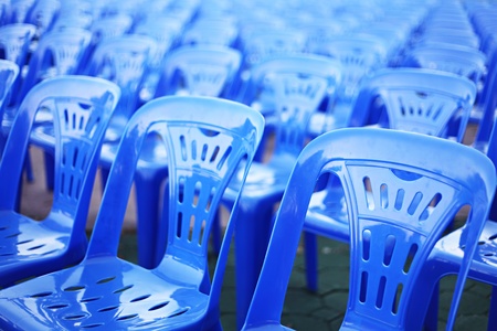 Rows of blue color chairs in an event fieldの写真素材