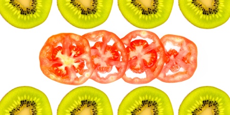 Half of kiwi and sliced tomato isolated on white backgroundの写真素材