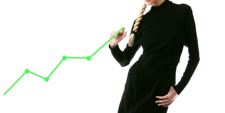 Businesswoman showing the green growth graphの写真素材