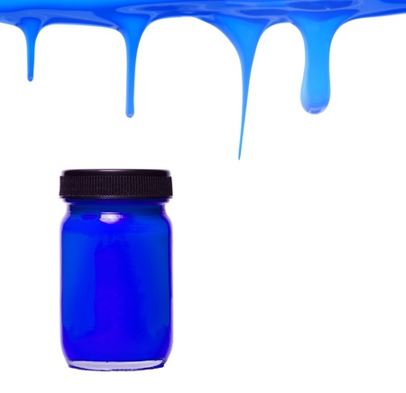 Blue paint dripping with color bottleの写真素材