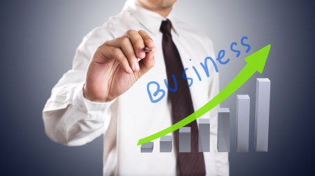 Business man drawing growth graphの写真素材