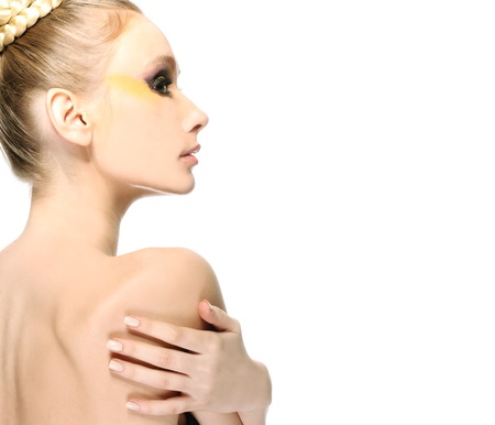 Woman touching her own arm isolate on white backgroundの写真素材