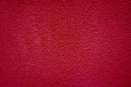 Uneven red plaster backgroundの写真素材