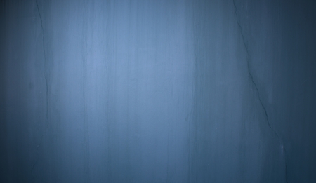 Dark stone wall with cracks as a backgroundの写真素材