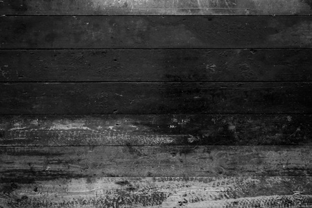 Dirty wooden background with grey and black weathered planksの写真素材