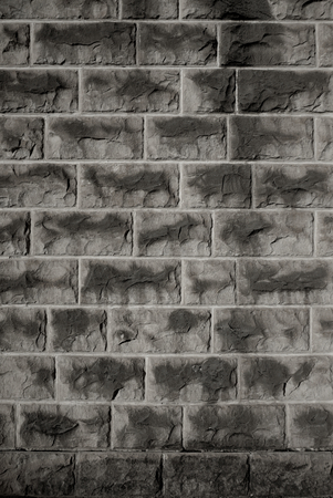 Weathered wall background with old dark stones