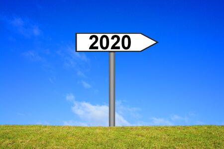 White waywiser sign showing direction to year 2020の写真素材