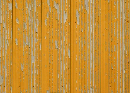 Weathered metal wall wilth orange colorの写真素材