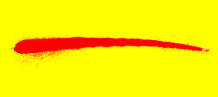 Red graffiti spray stripe on yellow backgroundの写真素材