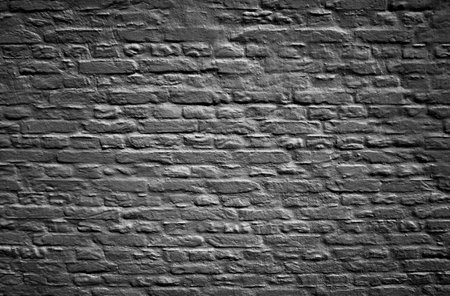 Dark weathered brick wall texture backgroundの写真素材