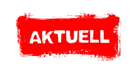 Red grunge paintbrush banne rshowing Current in german languageの写真素材