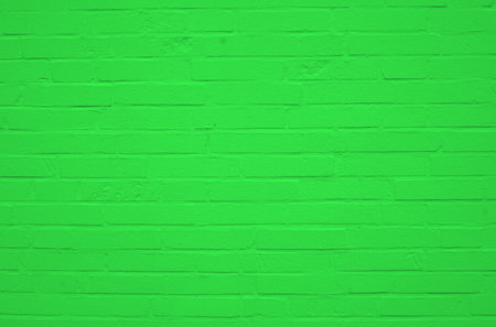 Dirty old concrete brick wall with green colorの写真素材