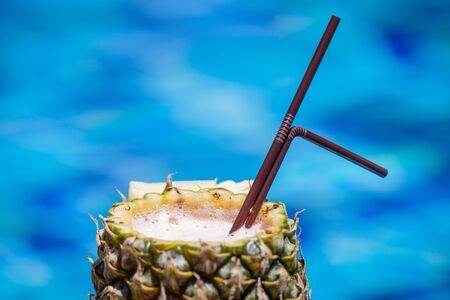 Fresh pineapple juice on the blue backgroundの写真素材