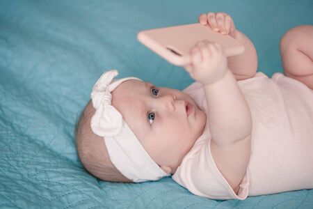 Newborn girl intrested in phone