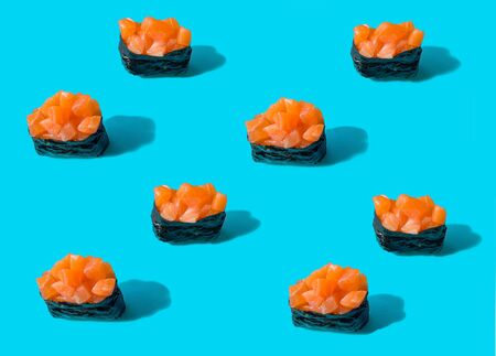 Sushi gunkan with salmon on blue backgroundの写真素材