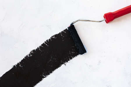 Paint roller and black color on White background. High quality photoの写真素材
