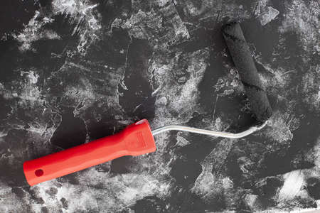 Paint roller and black color on White background. High quality photoの写真素材