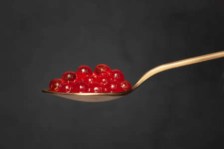 Red caviar in the spoon. High quality photo