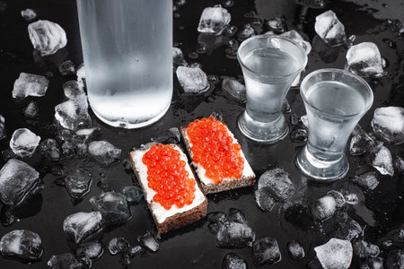 Vodka and sandwiches with red caviarの写真素材