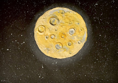Creative childrens crafts plasticine detailed moon with craters in open space