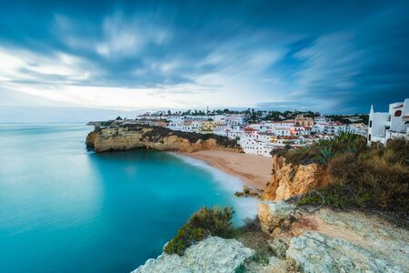 Village of Carvoeiro and calm sea, high level view, Algarve, Portugal, Europeの写真素材