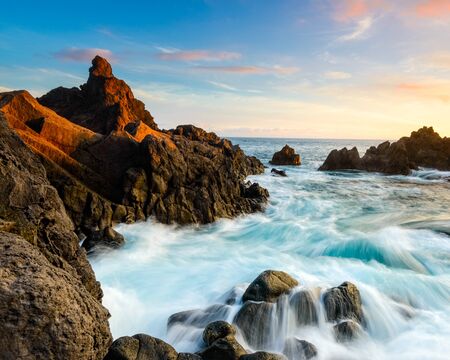 Seawater flooding a coastal inlet at dawn. Madeiraの写真素材