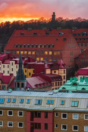 A breathtaking sunset paints the sky in vibrant colors over Gothenburgs residential district, showcasing its stunning architecture and built structures.の写真素材