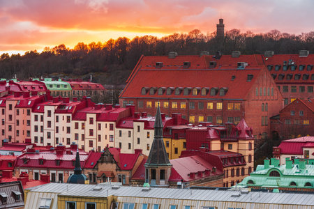 A breathtaking sunset paints the sky in vibrant colors over Gothenburgs residential district, showcasing its stunning architecture and built structures.の写真素材