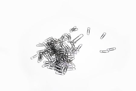 Metal paper clip isolated on white background.の写真素材