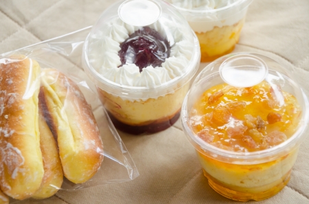 Cupcakes in a plastic cup and sweet breadの写真素材