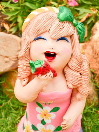 Cute Clay doll in the gardenの写真素材