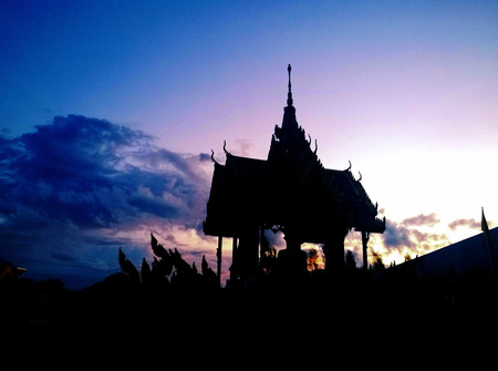 silhouette of temple in Thailand with sunset skyの写真素材