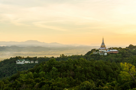 Tha Ton Temple set amid green mountains with sunset sky,Place for religious practices of Thailandの写真素材