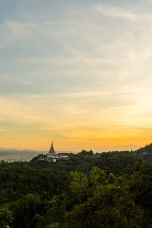 Tha Ton Temple set amid green mountains with sunset sky,Place for religious practices of Thailandの写真素材