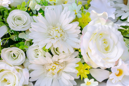 artificial flowers of white Rose and Gerbera for decoration,group of beautiful plastic flower bouquetの写真素材