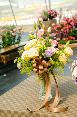 Arrange of beautiful sunflower and green leaves bouquet, Creative to decorate with flowers arrangementの写真素材