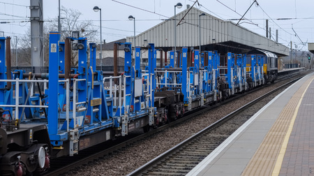 a diesel locomotive pulls an engineering train of some kind, use unknownの写真素材