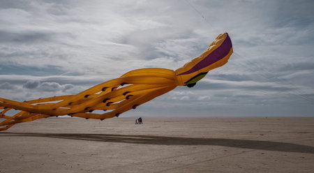 St Annes, Lancashire/United Kingdom - September 14 2024: St Annes Kite Festival. A vibrant display of colorful kites fills the sky as beachgoers enjoy a lively day by the seaside.の写真素材