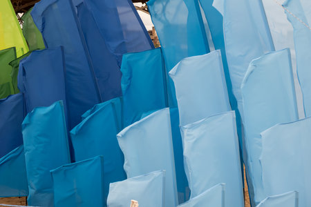 Bright future, success, and opportunity represented by colorful flags waving in the wind.の写真素材