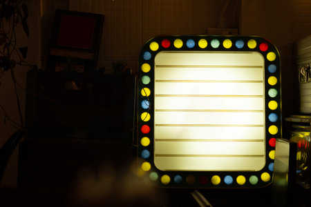 Lightbox sign with colorful border in dimly lit roomの写真素材