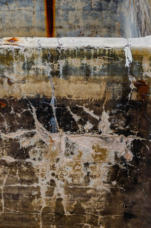 Texture of rust on weathered concrete structure with worn and weathered surface