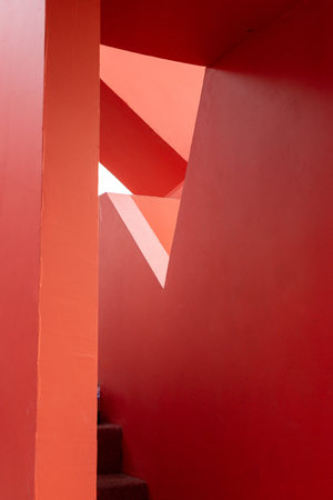 Abstract geometry of red architectural structure