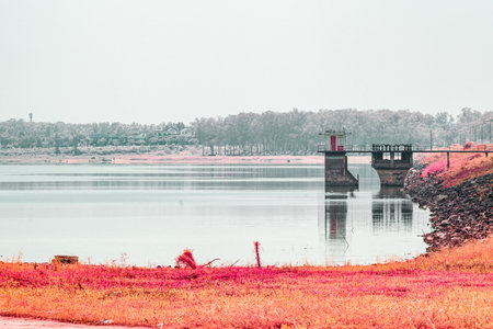 Infrared photography, a serene body of wate with a structure