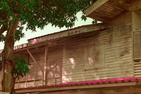Infrared photography, a weathered wooden building with a partially visible upper level