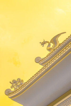 Infrared photography, the corner of a building with a roof, decorative elements, including a dragon...
