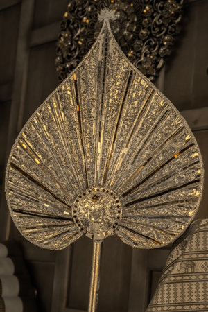 A decorative fan with patterns and a shimmering surfaceの写真素材