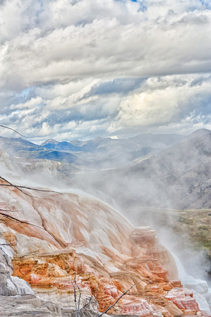Landscape of storm clouds over Canary Springs, Mammoth Falls, Yellowstone National Park.の写真素材