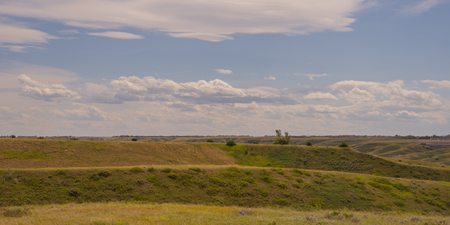 Landscape of foothills with a cloudy sky.の写真素材