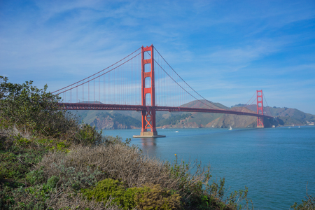 Golden Gate bridge with blue sky and blue water.の写真素材