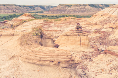 inukshuk in a landscape of the Badlands of Drumheller, Alberta, Canada